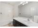 Clean bathroom, bathtub, toilet and dark vanity at 10808 W Cottontail Ln, Peoria, AZ 85383