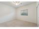 Spacious bedroom with window, blinds and ceiling fan at 10808 W Cottontail Ln, Peoria, AZ 85383