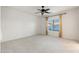 Bright bedroom with ceiling fan and window coverings at 10808 W Cottontail Ln, Peoria, AZ 85383