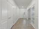 Bright entryway with tile flooring, white walls, and French doors at 10808 W Cottontail Ln, Peoria, AZ 85383