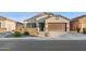 Single story home with a two-car garage and well maintained landscaping at 10808 W Cottontail Ln, Peoria, AZ 85383