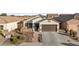 Single-story home with a brown garage door and stone accents at 10808 W Cottontail Ln, Peoria, AZ 85383