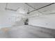 Garage with overhead storage racks and additional shelving at 10808 W Cottontail Ln, Peoria, AZ 85383