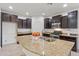 Spacious kitchen with granite countertops and stainless steel appliances at 10808 W Cottontail Ln, Peoria, AZ 85383