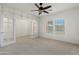 Bright office with neutral walls, carpet, ceiling fan, and French doors at 10808 W Cottontail Ln, Peoria, AZ 85383