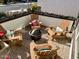 Cozy patio with fire pit and four adirondack chairs at 10808 W Cottontail Ln, Peoria, AZ 85383