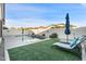 Lush green grass surrounds this refreshing pool and patio area at 10808 W Cottontail Ln, Peoria, AZ 85383