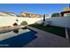 Private pool area with lounge chairs and artificial turf at 10808 W Cottontail Ln, Peoria, AZ 85383