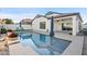 Relaxing backyard oasis featuring a sparkling pool and patio at 10808 W Cottontail Ln, Peoria, AZ 85383