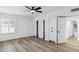 Bright bedroom featuring wood flooring and ample closet space at 10846 E Navajo Dr, Sun Lakes, AZ 85248