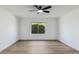 Bright bedroom with a window and ceiling fan at 10846 E Navajo Dr, Sun Lakes, AZ 85248