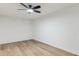 Simple bedroom with ceiling fan and light wood floors at 10846 E Navajo Dr, Sun Lakes, AZ 85248