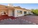 House exterior with red brick patio and landscaping at 10846 E Navajo Dr, Sun Lakes, AZ 85248