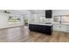 Modern kitchen with white cabinets, large island and stainless steel appliances at 10846 E Navajo Dr, Sun Lakes, AZ 85248