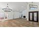 Spacious living room with hardwood floors, fireplace and chandelier at 10846 E Navajo Dr, Sun Lakes, AZ 85248