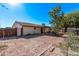 House exterior and backyard with mature trees and landscaping at 11530 E Marguerite Ave, Mesa, AZ 85208