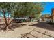 Large backyard with mature trees and desert landscaping at 11530 E Marguerite Ave, Mesa, AZ 85208