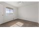 Bright bedroom with carpeted floor, ceiling fan, and window at 11530 E Marguerite Ave, Mesa, AZ 85208