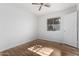 Light bedroom featuring hardwood floors and a ceiling fan at 11530 E Marguerite Ave, Mesa, AZ 85208