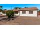 Ranch style home with mature landscaping and a gravel driveway at 11530 E Marguerite Ave, Mesa, AZ 85208