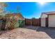 Backyard access gate with wood and metal fencing at 11530 E Marguerite Ave, Mesa, AZ 85208