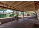 Covered patio with concrete slab and backyard access at 11530 E Marguerite Ave, Mesa, AZ 85208