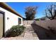 Landscaped backyard with gravel, walkway, and block wall at 1201 W Ducasse Dr, Phoenix, AZ 85013