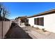Backyard with gravel, walkway, and partial view of patio at 1201 W Ducasse Dr, Phoenix, AZ 85013