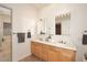 Bathroom with double vanity and a large mirror at 1201 W Ducasse Dr, Phoenix, AZ 85013