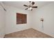 Bedroom with tile flooring, ceiling fan and window blinds at 1201 W Ducasse Dr, Phoenix, AZ 85013