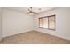 Bright bedroom with ceiling fan and tile floors at 1201 W Ducasse Dr, Phoenix, AZ 85013