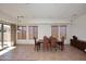 Bright dining room with tile flooring and backyard access at 1201 W Ducasse Dr, Phoenix, AZ 85013
