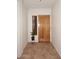 Bright entryway with tile flooring and wood door at 1201 W Ducasse Dr, Phoenix, AZ 85013