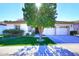Single-story home with two-car garage and landscaped front yard at 1201 W Ducasse Dr, Phoenix, AZ 85013