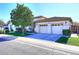Tan house with two-car garage and well-maintained lawn at 1201 W Ducasse Dr, Phoenix, AZ 85013