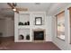 Living room fireplace with built-in shelving at 1201 W Ducasse Dr, Phoenix, AZ 85013