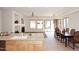 Kitchen features island with sink, opens to dining area with patio access at 1201 W Ducasse Dr, Phoenix, AZ 85013