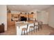 Spacious kitchen with island, ample cabinetry, and tile flooring at 1201 W Ducasse Dr, Phoenix, AZ 85013