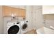 Laundry room with LG washer and dryer, cabinets and storage at 1201 W Ducasse Dr, Phoenix, AZ 85013