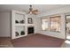 Living room with fireplace and built-in shelving at 1201 W Ducasse Dr, Phoenix, AZ 85013