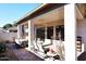 Covered patio with seating area and outdoor dining table at 1201 W Ducasse Dr, Phoenix, AZ 85013