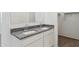 Bathroom with double vanity and granite countertop at 1413 W Hess Ave, Coolidge, AZ 85128