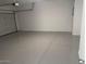 Spacious garage with a gray epoxy floor, room for two cars and extra storage at 1413 W Hess Ave, Coolidge, AZ 85128