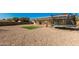 Large backyard with gravel, artificial turf, and trampoline at 1485 W 14Th Ave, Apache Junction, AZ 85120