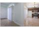 View of kitchen from entryway with tile floors at 14905 W Ashland Ave, Goodyear, AZ 85395