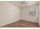 Bright bedroom with ceiling fan, window, and closet at 15345 W Jefferson St, Goodyear, AZ 85338