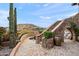 Landscaped backyard oasis with a spa and a stone staircase at 16117 E Shooting Star Trl, Fountain Hills, AZ 85268