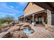 Luxury backyard with a hot tub, fireplace, and expansive patio at 16117 E Shooting Star Trl, Fountain Hills, AZ 85268