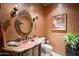 Elegant powder room with copper sink and ornate mirror at 16117 E Shooting Star Trl, Fountain Hills, AZ 85268