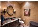 Powder room with copper sink and artwork at 16117 E Shooting Star Trl, Fountain Hills, AZ 85268
